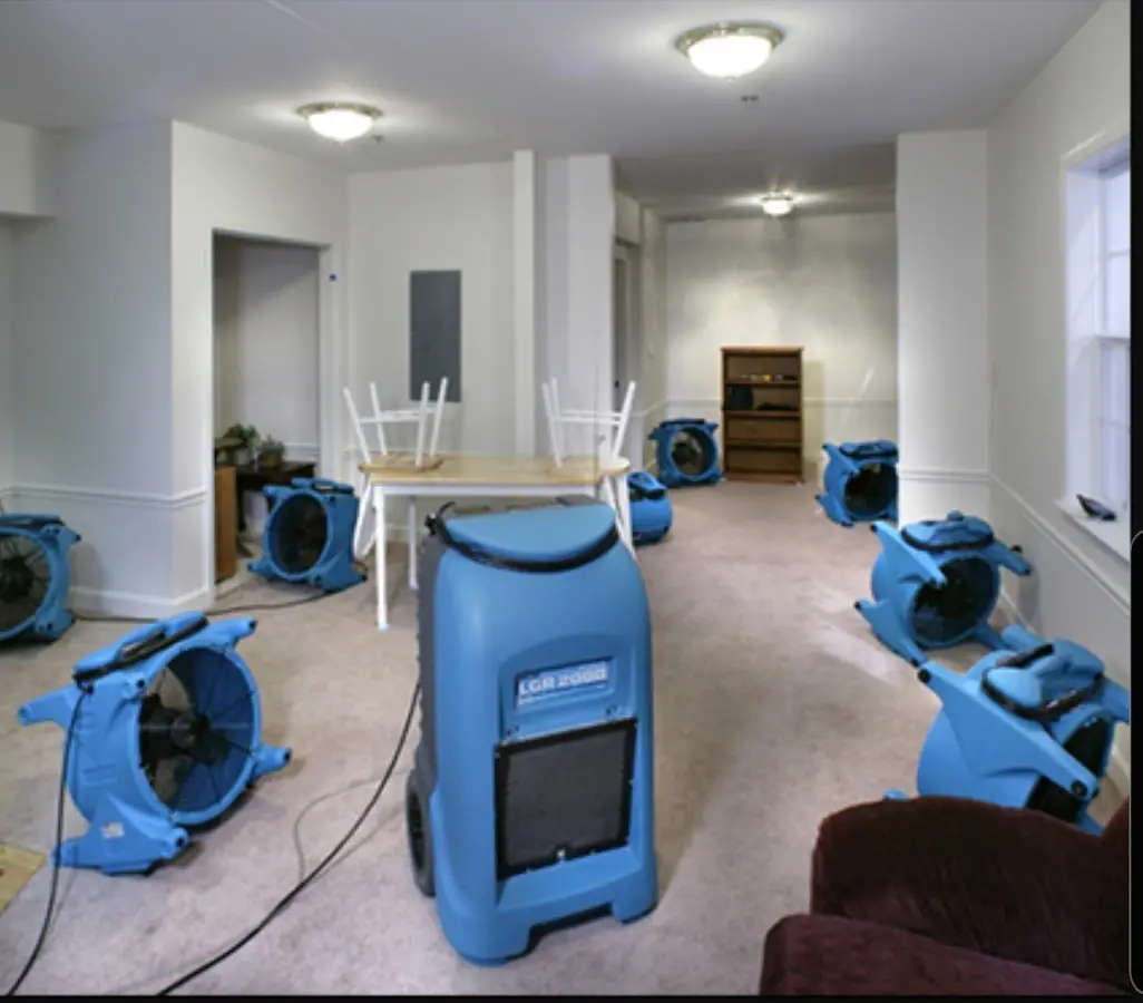 Air movers and dehumidifier setup for Water Damage Restoration in Chenango